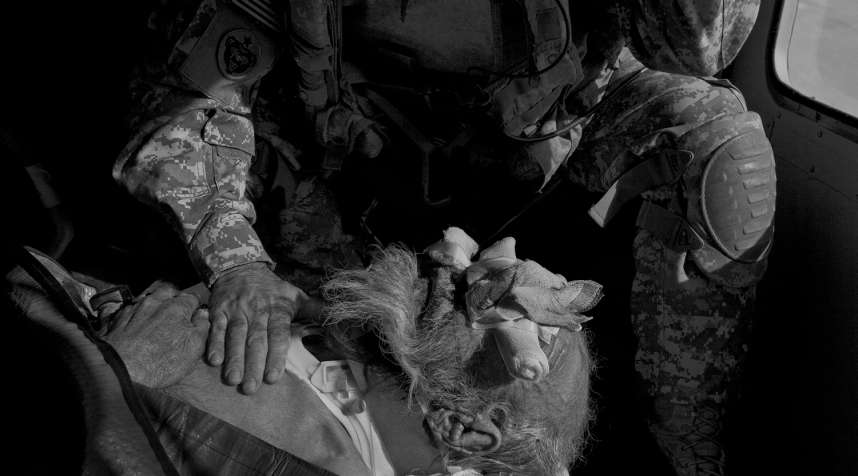 The crew members treat an Afghan man who was injured when his truck rolled over into an irrigation ditch. In addition to responding to wounded American and coalition troops, the medevac units provide care for ordinary Afghans with grave medical conditions.