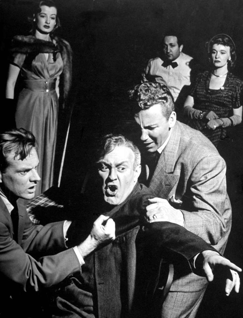 Actor Lee J. Cobb plays Willy Loman being restrained while babbling at imaginary characters in the Broadway production of  Death of a Salesman  in 1949. The play made Arthur Miller famous, and turned Willy Loman into a shorthand phrase for a deluded loser who dreams of success beyond himself.