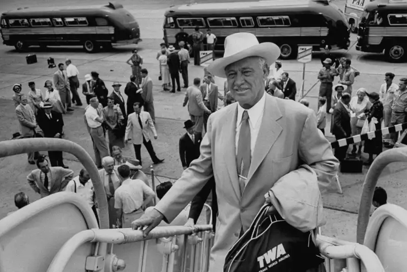 Hilton arriving at an airport in Spain.