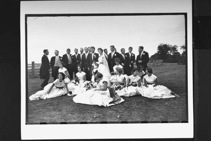 JFK and his bride pose on the lawn with 14 ushers and 10 bridesmaids.