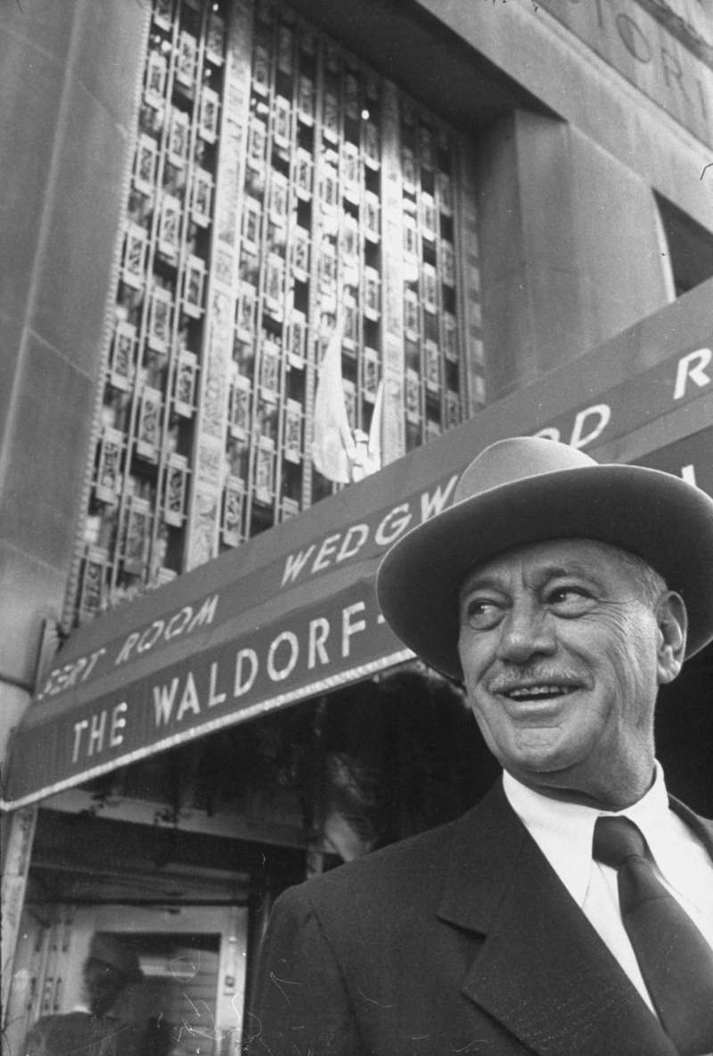 The magnate stands outside Manhattan's Waldorf-Astoria, which he bought in 1949. An incredibly ambitious man, Hilton desperately wanted the property because it was the high-profile home of some of the world's biggest political and social events.