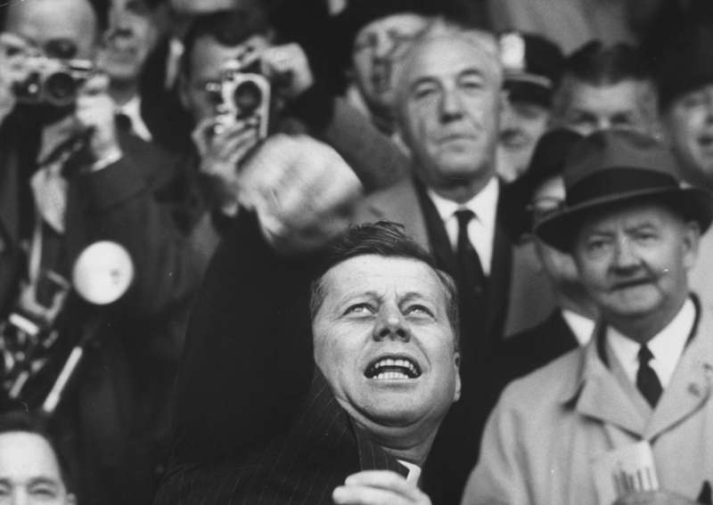 President John F. Kennedy finds some fun time during his busy 100 first days, inaugurating baseball season by tossing out the first ball in April 1961.