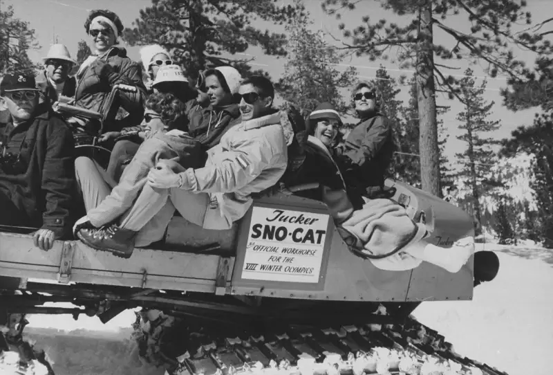 Squaw Valley Olympic athletes ride The Cripple Cat, a Sno-Cat meant to transport competitors who happened to get injured during the games.