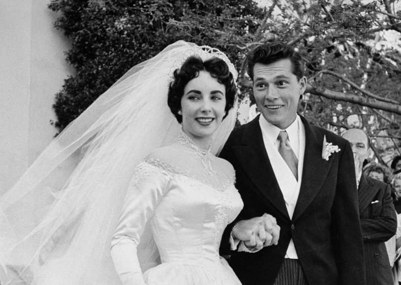 In 1950, Conrad's son, Conrad  Nicky  Hilton Jr., became Elizabeth Taylor's first husband. The marriage lasted a little over 8 months.
