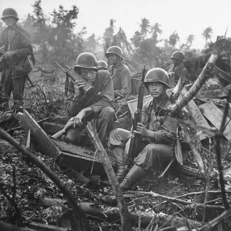 Mud, Endless Mud
United States Marines from the 1st Provisional Brigade sit in pouring rain during a lull in the fighting for the Orote Peninsula, Guam.