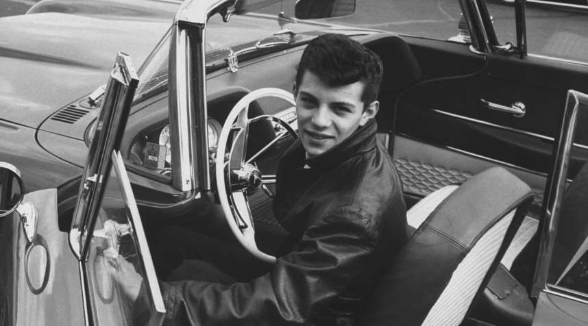 Frankie Avalon shows off his 1958 Pontiac convertible in a photograph from March 1959.  Avalon's musical career had already begun to yield hit singles by the late 1950s, though the singer later became famous for his acting roles.