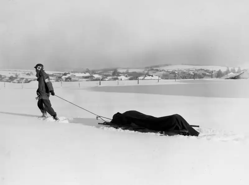 An American medic transports the wounded.