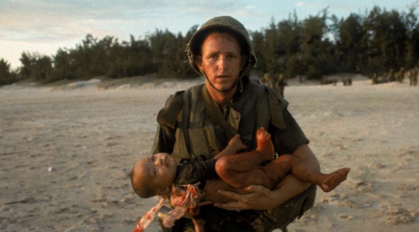 Paul Schutzer's jarring photograph of a U.S. medical corpsman running with an injured Vietnamese baby after the child's mother wandered into a combat zone has a nightmarish feeling about it -- a feeling only heightened when one notices that the wounded child's eyes are locked on the viewer, as if asking for help, or quietly passing judgment.
