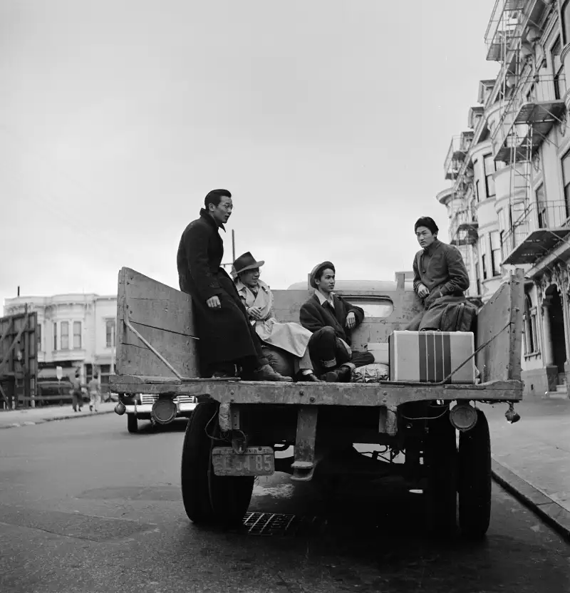 Four Japanese-Americans prepare to be sent to an internment camp on February 28, 1942.