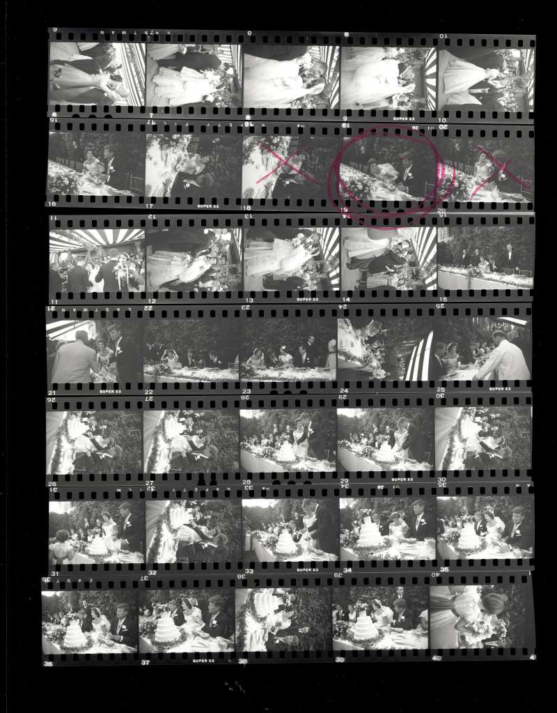 A contact sheet from LIFE photographer Lisa Larsen's pictures from the wedding -- with the famous shot of John and Jackie feasting on pineapple circled in the photo editor's traditional red pencil. , the circle says,