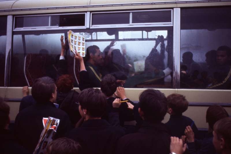 English fans happily swarm around the Brazilian squad's bus, 1966.