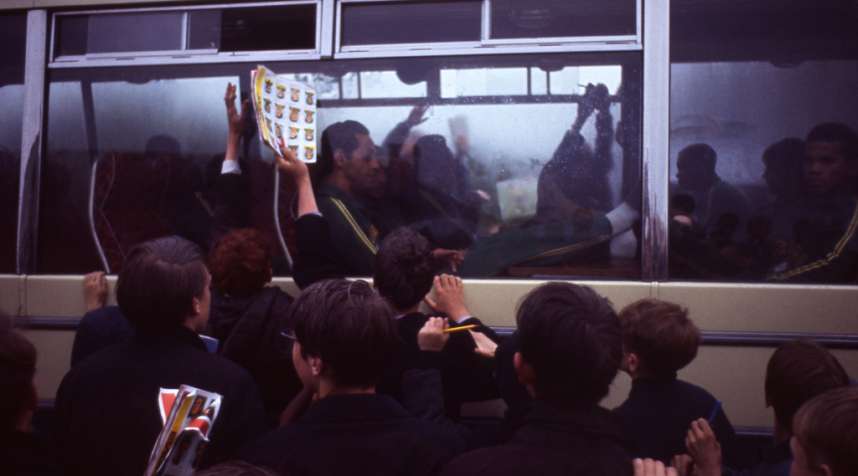 Not published in LIFE. English fans happily swarm around the Brazilian squad's bus, 1966.