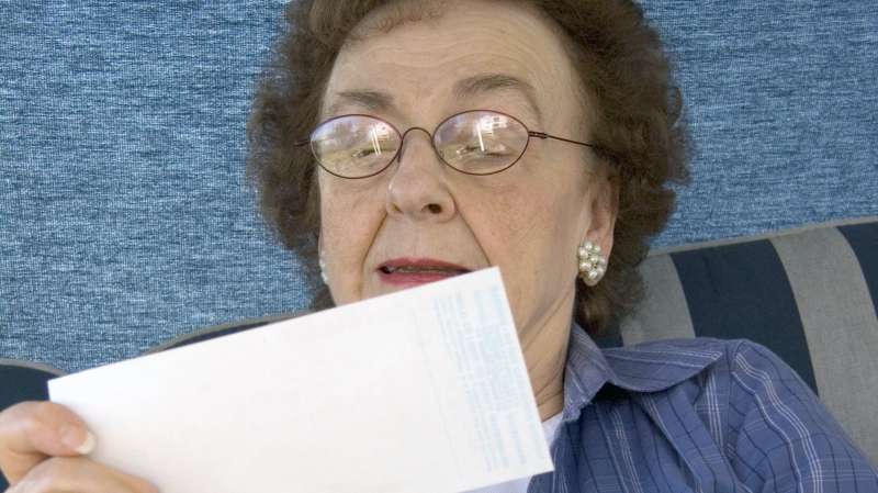 Senior woman looking at Social Security check
