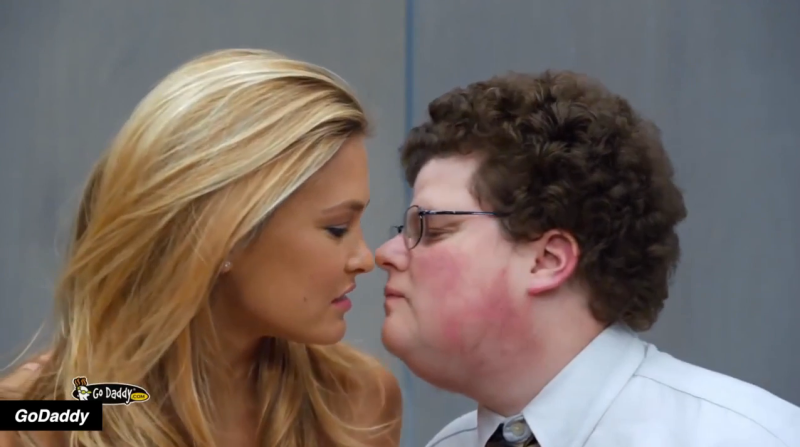 GoDaddy Ad with model Bar Refaeli kissing nerd.
