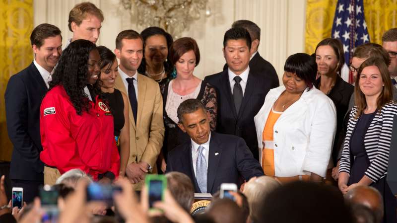 President Obama signing a Presidential Memorandum reducing burden of student loan debt