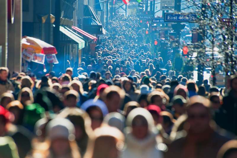 Crowd of commuters walking in midtown New York