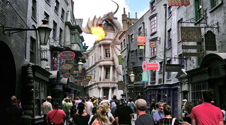 A dragon breathes fire above The Wizarding World of Harry Potter-Diagon Alley during a media preview at the Universal Orlando.