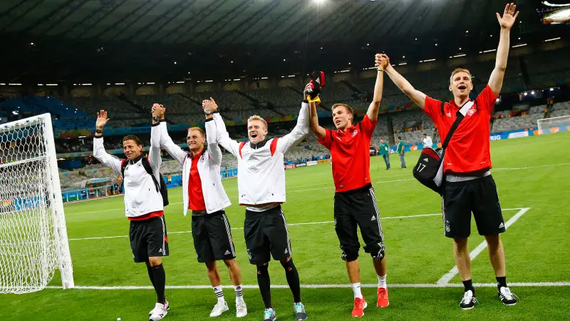 Germany's national soccer players Roman Weidenfeller, Shkodran Mustafi, Andre Schuerrle , Kevin Grosskreutz and Per Mertesacker celebrate