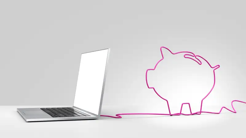 Laptop with cord in shape of piggy bank