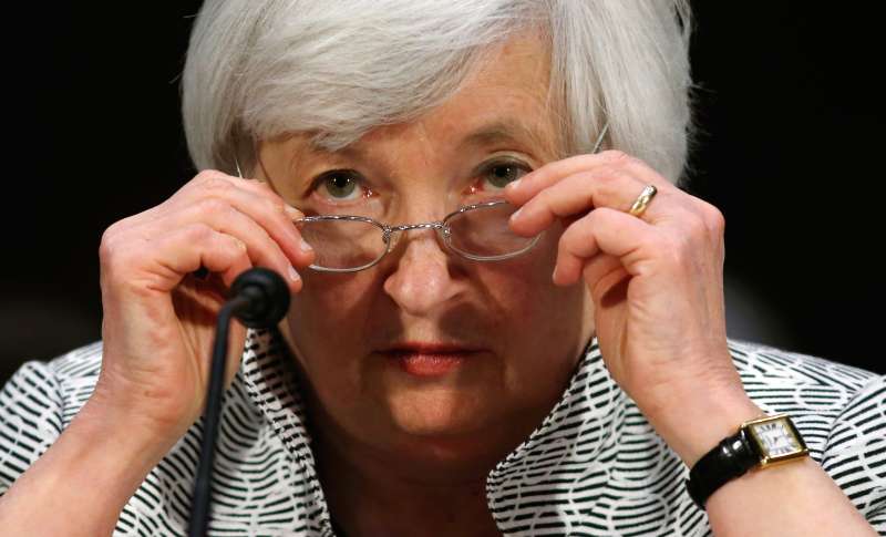 U.S. Federal Reserve Chair Janet Yellen adjusts her glasses