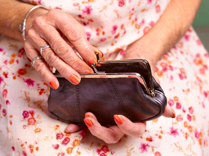 Grandma opening coin purse