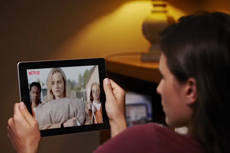 Woman watching Netflix on iPad