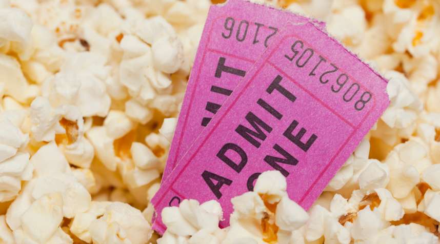 Popcorn with movie tickets