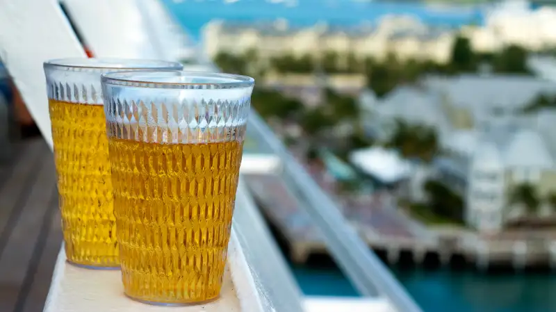 Draft beer glasses on rail of ship