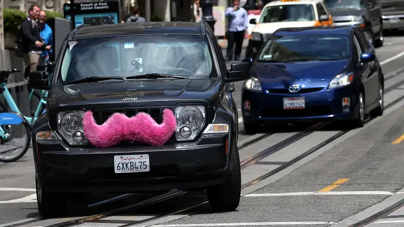 A Lyft car drives along Powell Street on June 12, 2014 in San Francisco, California.