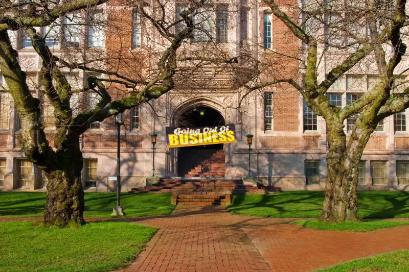 Academic building with Going out of Business sign on door