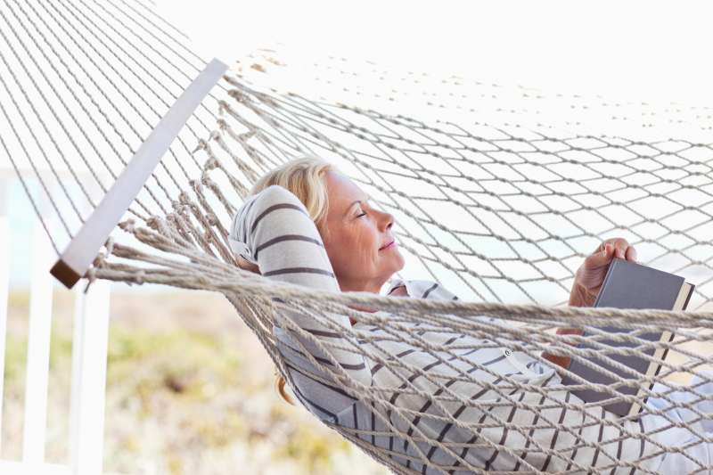 Senior woman relaxing in hammock