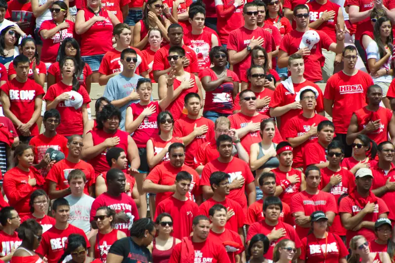 Houston football fans singing the National Anthem