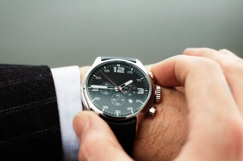 Man checking wrist watch