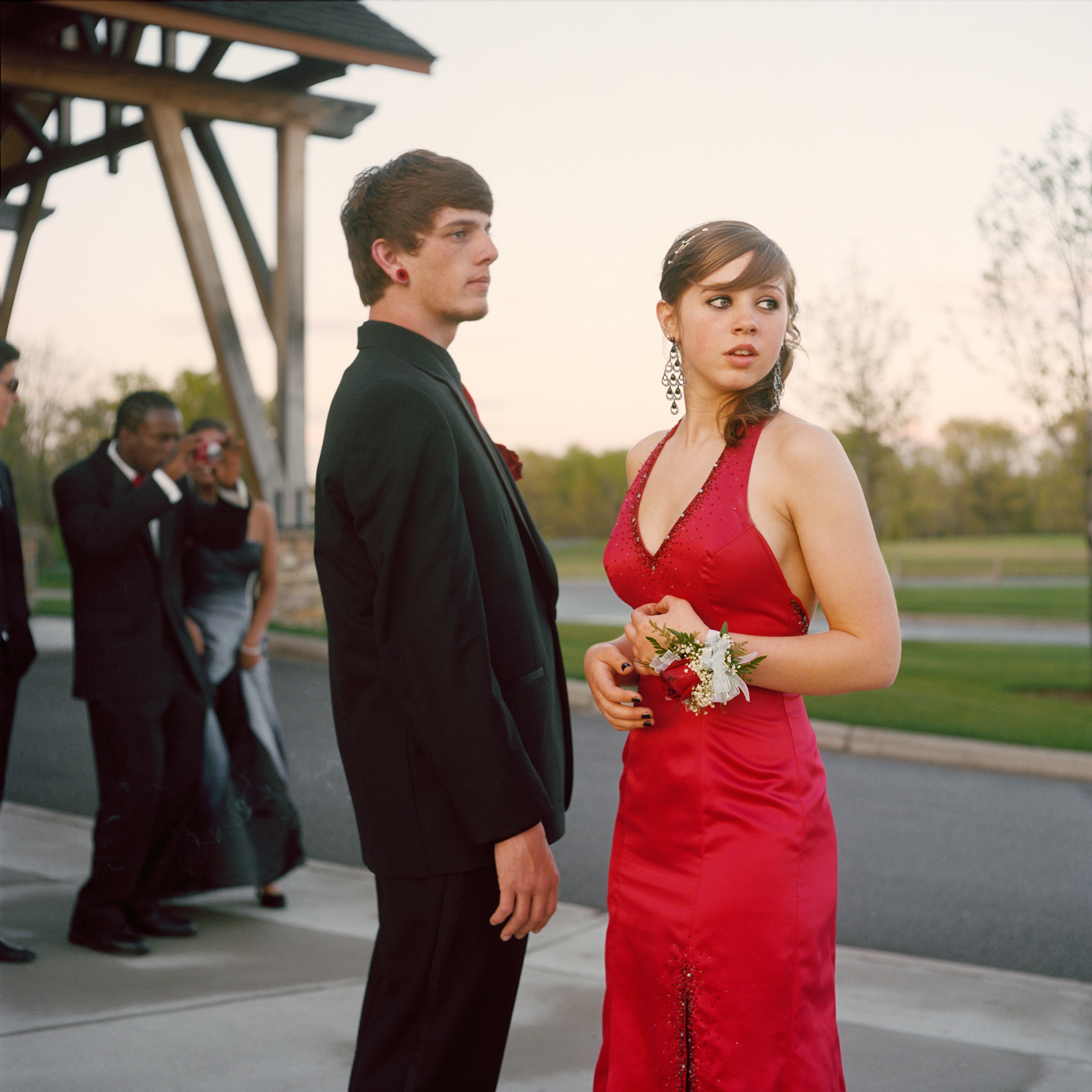 <strong>In 2014, the average cost for a prom dress was $195, according to <a href="http://www.statisticbrain.com/prom-night-statistics/" title="Statistic Brain" target="_blank">Seventeen Magazine</a>. On top of this, a teen girl's prom expenses include shoes, handbag, hair, makeup, manicure and jewelry.  However, teen boys are often expected to bear the costs for many prom activities, and the average costs of a limousine for four hours can be $450 and prom tickets can be $75.  This excludes his tuxedo, accessories, their dinner and transportation. For help making a budget, get the <a href="http://www.practicalmoneyskills.com/resources/prom2014.php" title="Visa Plan'it Prom app" target="_blank">Visa Plan'it Prom app</a>.</strong>
                                            
                                            Title: "Nick and Angel," from the series <em><a href="http://amyandersonart.com/crossroads.htm" title="At Risk, With Promise" target="_blank">At Risk, With Promise.</a></em>
                                            
                                            <a href="http://amyandersonart.com/" title="Amy Anderson" target="_blank">Amy Anderson</a> has been documenting students at Crossroads Alternative High School for the last four years. Coming from diverse backgrounds, they have been unable to be successful in a traditional school setting for various reasons. Some are brilliant, kind, articulate teenagers; some are abused, addicted, angry youth…many are both. Though they carry the wounds and fears of their past, her portraits honor the strength that develops as they begin a new journey and make changes and choices that will shape their lives.