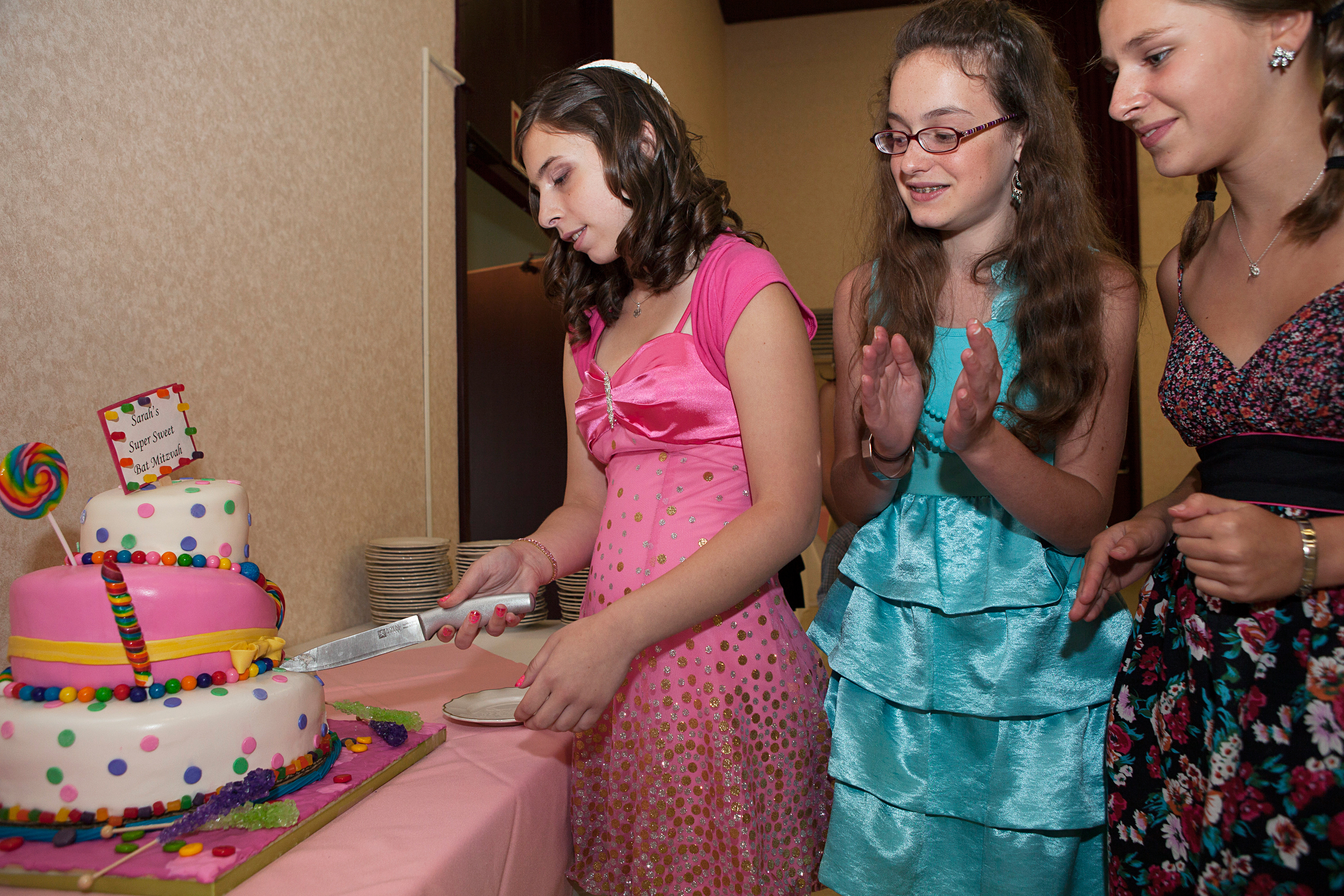 <strong>According to industry estimates, "the average bar or bat mitzvah budget runs roughly $15,000 to $30,000," writes <a href="http://www.emitz.com/budget" title="eMitz.com: the Bar Bat Mitzvah Planning, Ideas, Vendor Reviews and Invitations Site" target="_blank">eMitz.com</a>, the Bar and Bat Mitzvah Planning site. "Many variables come into play, such as: time of year, time of day, number of guests and the region.  Manhattan and LA are the priciest."</strong>
                                            
                                            Title: "Sarah's Bat Mitzvah, Buffalo, NY," from the series <a href="http://www.rebeccagreenfield.com/#a=0&amp;at=0&amp;mi=2&amp;pt=1&amp;pi=10000&amp;s=0&amp;p=4" title="Coming of Age" target="_blank"><em>Coming of Age.</em></a>
                                            
                                            <a href="http://www.rebeccagreenfield.com/" title="Rebecca Greenfield" target="_blank">Rebecca Greenfield</a> has been documenting contemporary American female rites of passage for the past six years, photographing coming of age traditions such as Quinceañeras, Bat Mitzvahs, Debutante Balls, Prom, Homecoming, Sweet Sixteen, Purity Balls, Sorority Rush, Apache Sunrise Dances and more. She looks forward to publishing the project in book form when complete.