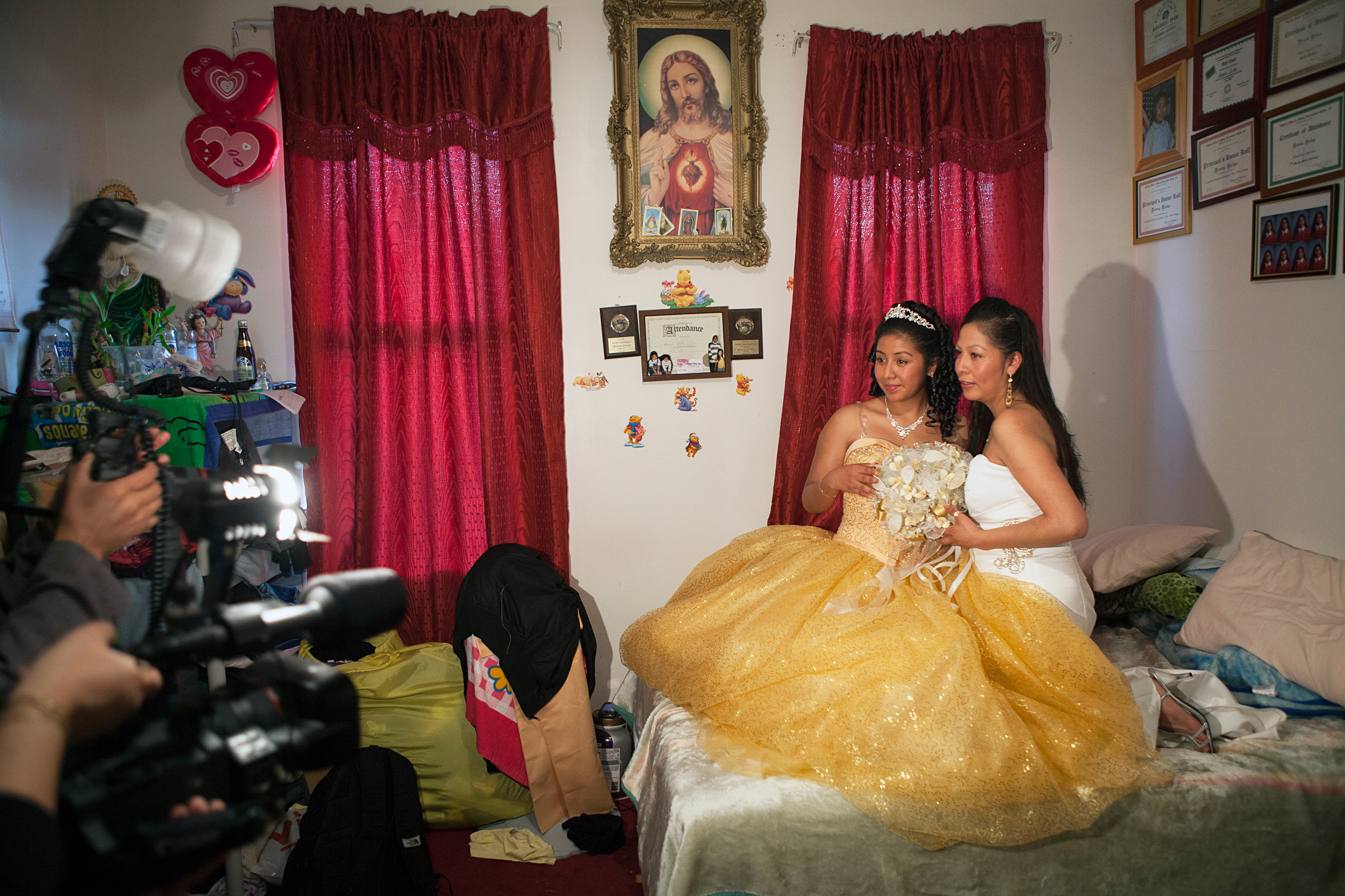 <strong>More than 400,000 Hispanic girls celebrated quinceañeras in 2011. Each family spent an average of $5,000 to $10,000, adding up to a $2 million- to $4 million-dollar industry, states <a href="http://corporate.univision.com/2011/09/latina-moms-and-the-quinceanera-tradition/" title="Univision – Latina Moms and the Quinceañera Tradition" target="_blank">Univision Communications.</a></strong>
                                          
                                          Title: "Ronnie and her mom pose for a photographer and videographer they've hired to document Ronnie's Quinceañera, Brooklyn, NY," from the series <em><a href="http://www.rebeccagreenfield.com/#a=0&amp;at=0&amp;mi=2&amp;pt=1&amp;pi=10000&amp;s=0&amp;p=5" title="Coming of Age" target="_blank">Coming of Age.</a></em>
                                          
                                          