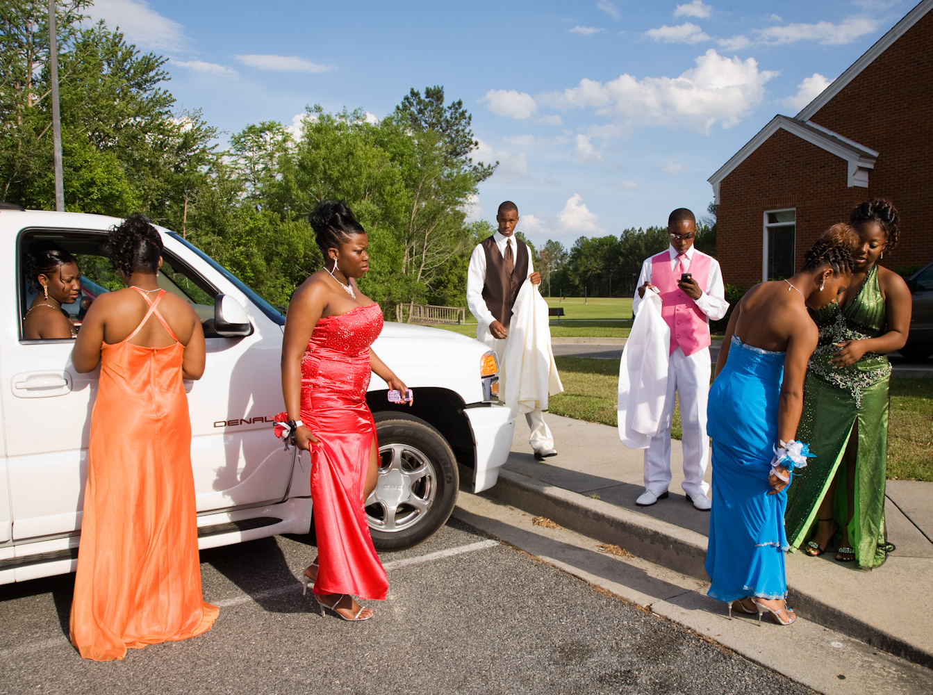 <strong>On average, in 2014, Southern families spent nearly $200 less on prom-related costs than the Northeast and West Coasts, the <a href="http://www.practicalmoneyskills.com/resources/pdfs/Visa_Prom_Survey_2014.pdf" title="2014 Visa Prom Spending Survey" target="_blank">2014 Visa Prom Spending Survey</a> discovered. The American average household spending on the annual high school rite of passage was $978.  Parents were planning to pay for 56% of prom costs, while their teens covered the remaining 44%.  </strong>
                                          
                                          Title: "Parking Lot of the First Integrated Prom, Lyons, Georgia 2010," from the series <a href="http://www.gillianlaub.com/#/Works%20and%20Projects/Southern%20Rites/1/" title="Southern Rites" target="_blank">Southern Rites.</a>
                                          
                                          For more than five years, <a href="http://www.gillianlaub.com/" title="Gillian Laub" target="_blank">Gillian Laub</a> has photographed Mt. Vernon, a town in Georgia where—despite the integration of its schools in 1971—the high school's fall homecoming and spring prom remain racially segregated. In 2009, <a href="http://www.nytimes.com/interactive/2009/05/24/magazine/dividedproms-audioss/" title="New York Times Magazine – A Prom Divided" target="_blank">The New York Times Magazine published some of these images in a photo essay and multimedia piece, "A Prom Divided."</a> It caused national outrage. Now, there is only one homecoming queen and one prom.