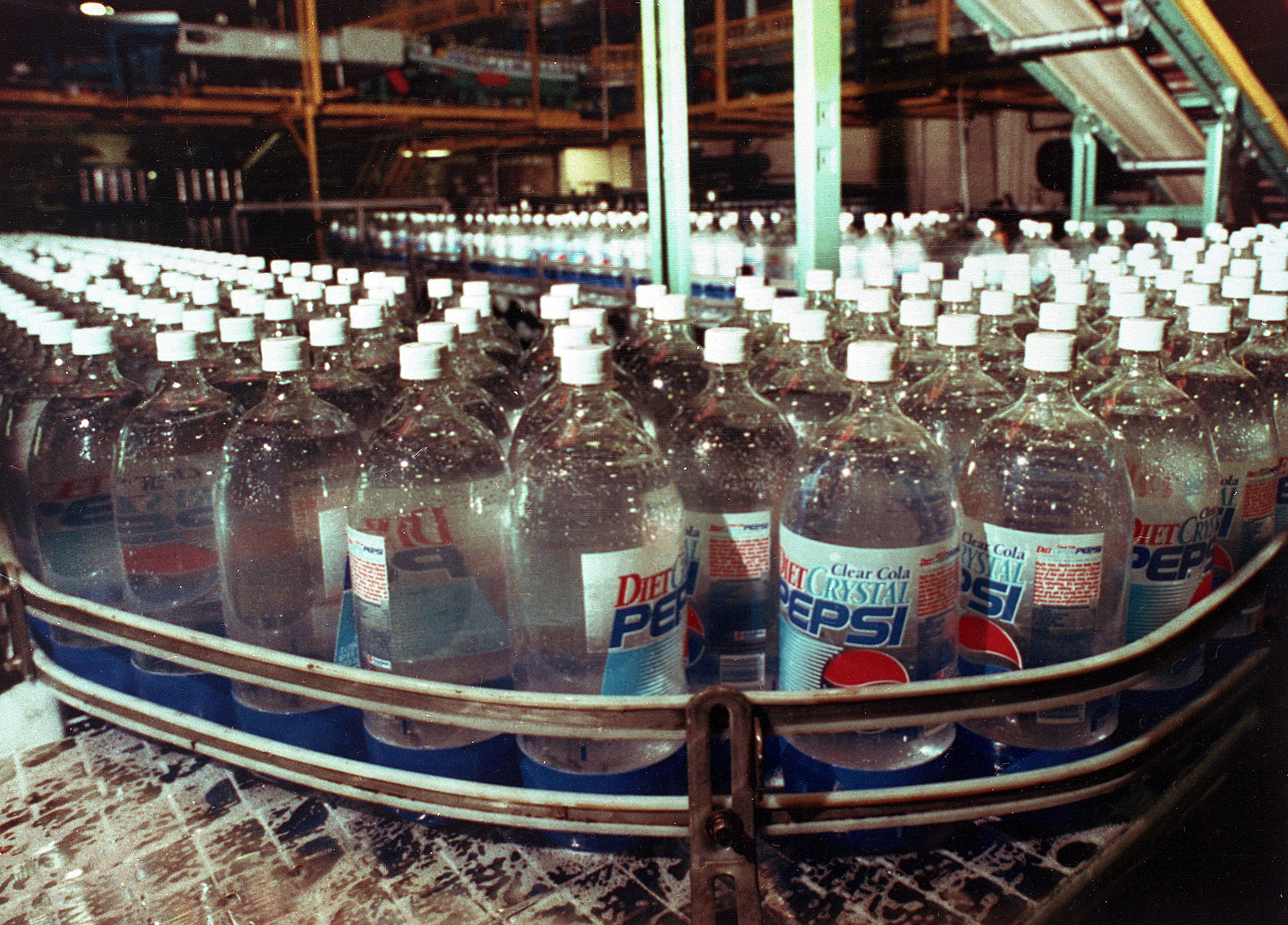 Bottles of Crystal Pepsi are seen in a bottling factory in 1992.