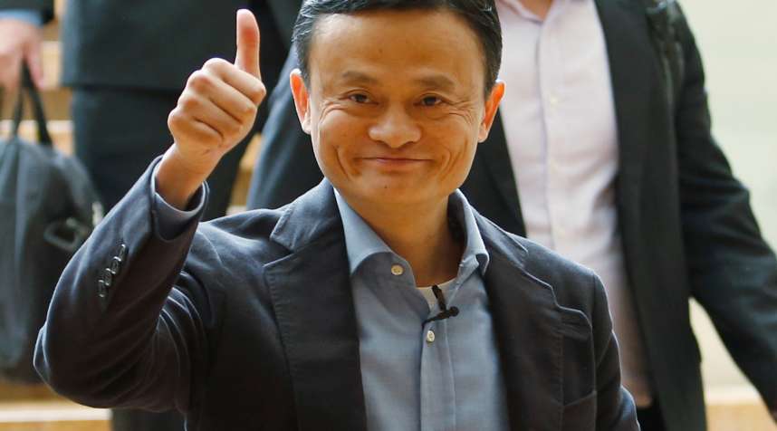 Alibaba founder Jack Ma gives a thumbs-up as he arrives to speak to investors at an initial public offering roadshow in Singapore September 16, 2014.