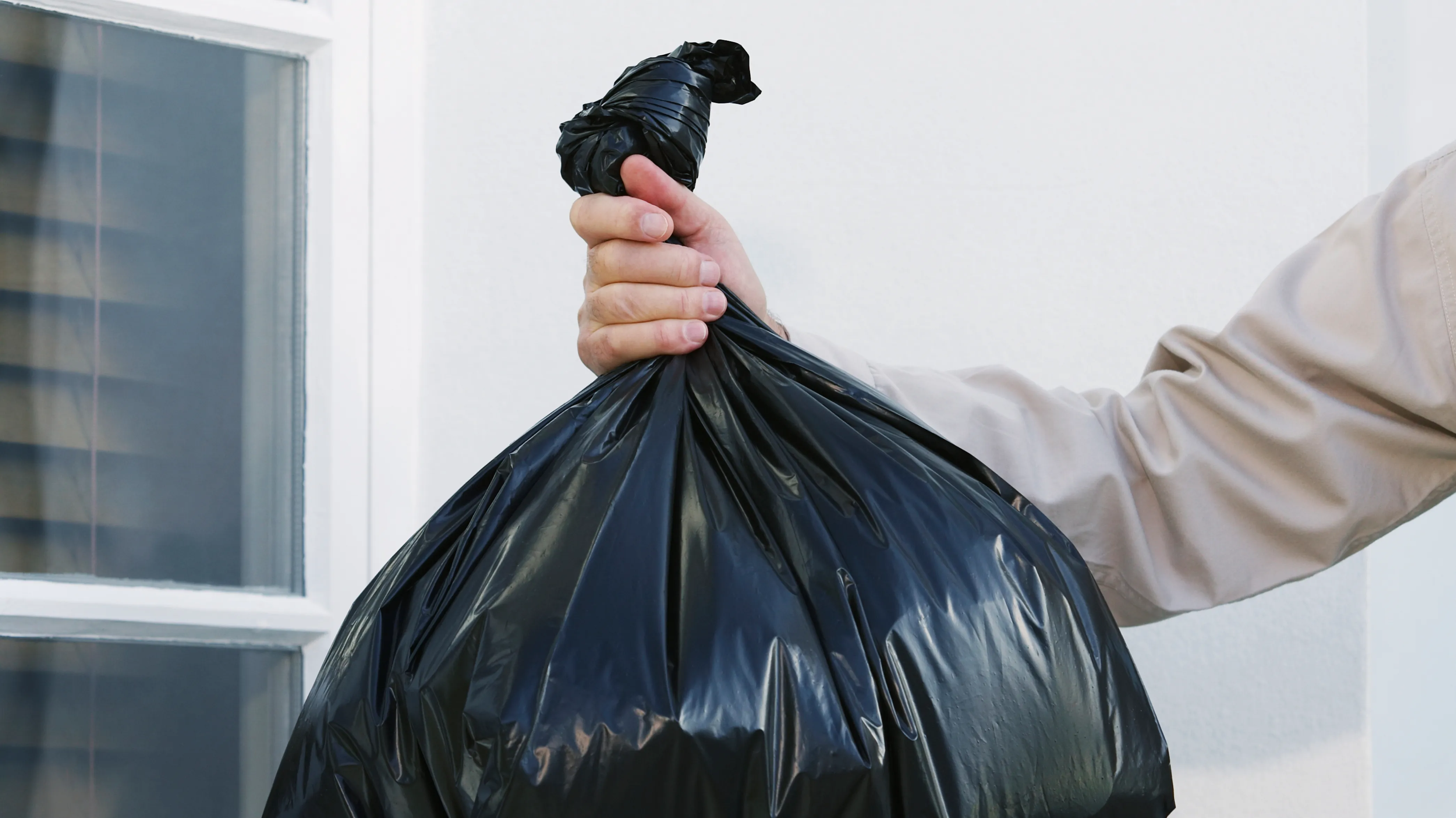 Large Garbage Bag Filled To With Plastic Waste Leaning Against