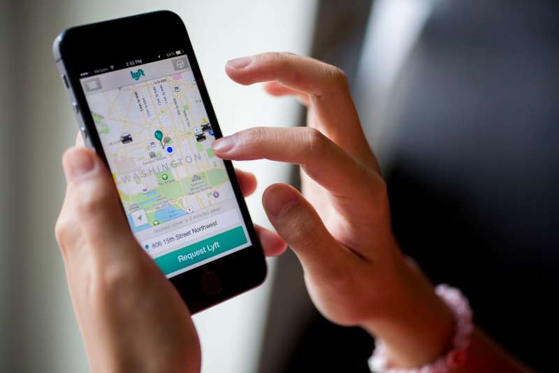 The Lyft Inc. application (app) is demonstrated on an Apple Inc. iPhone 5s for an arranged photograph in Washington, D.C., U.S., on Wednesday, July 9, 2014.