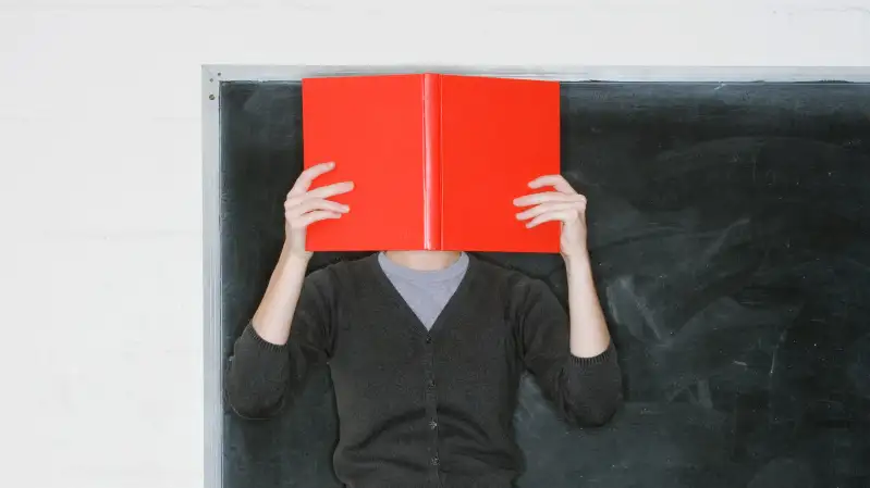 woman with head in a book
