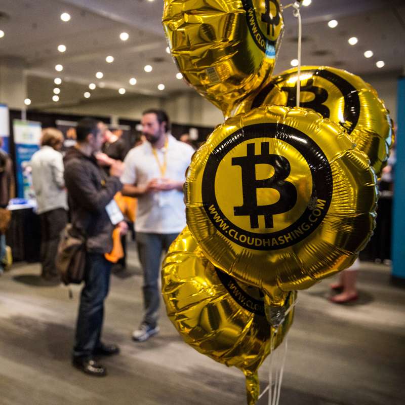 People attend a Bitcoin conference on at the Javits Center April 7, 2014 in New York City.