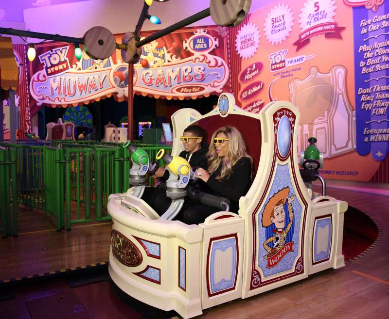 Daytime TV talk show host Wendy Williams and her son Kevin take a ride on  Toy Story Midway Mania!  during a visit to Disney's Hollywood Studios theme park at Walt Disney World Resort January 19, 2014 in Lake Buena Vista, Florida.