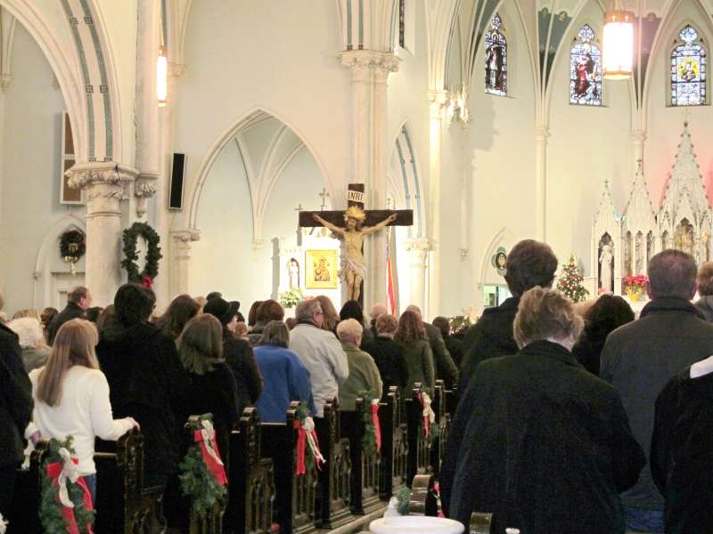 This Jan. 12, 2014 photo shows people gathered for mass inside Our Lady of Perpetual Help Church in Buffalo, N.Y., during a “Mass Mob.”