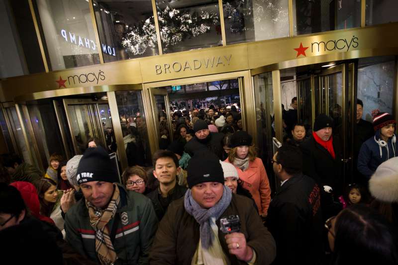 Eager shoppers crowd the entrance as they pour into the Macy's Herald Square flagship store, Thursday, Nov. 28, 2013, in New York
