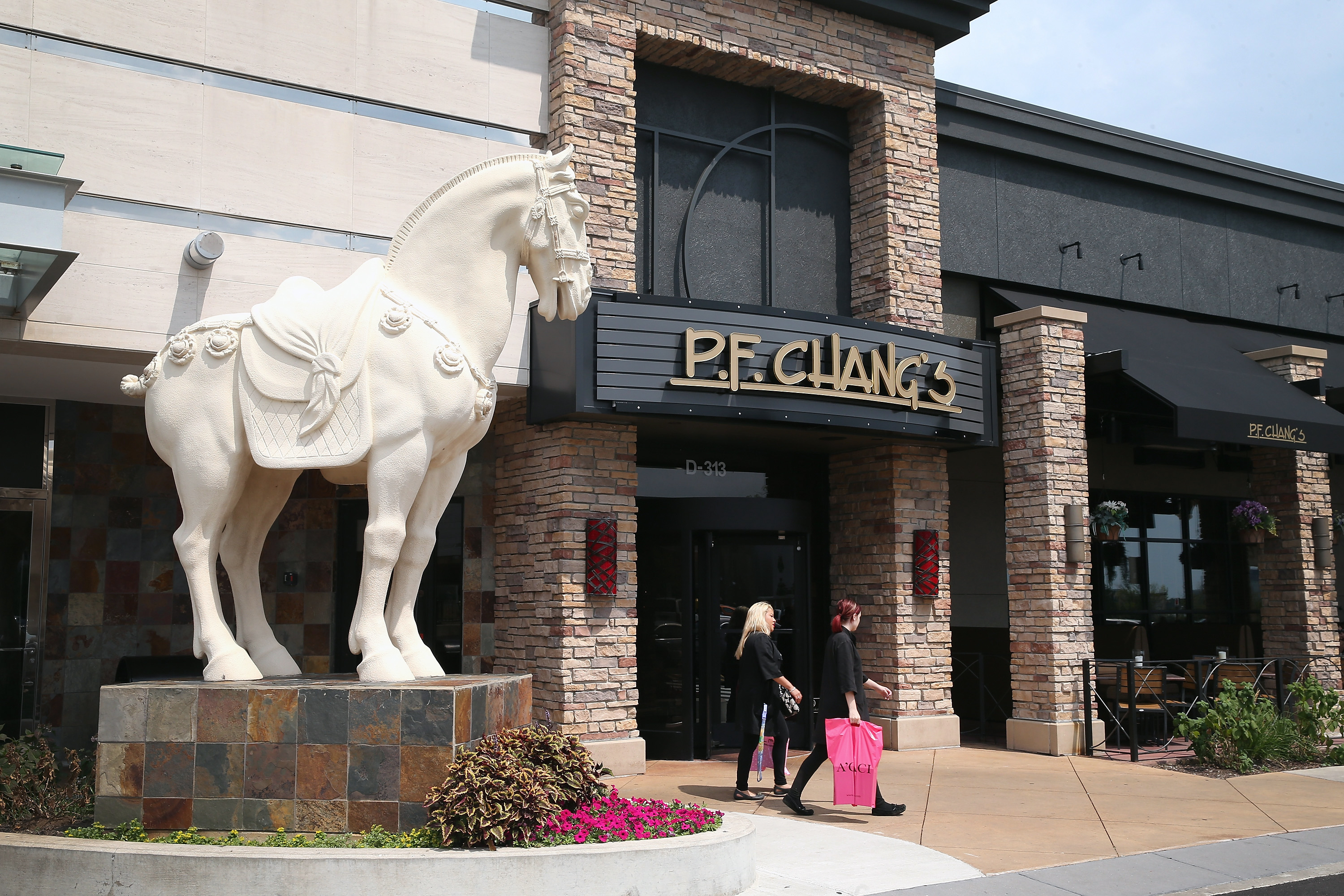 A statue of a horse stands at the entrance to a P.F. Chang's restaurant on August 4, 2014 in Schaumburg, Illinois.