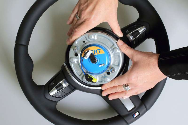 An airbag igniter is built into a steering wheel for a car at the Takata Ignition Systems Gmbh factory in Schoenebeck, Germany, 17 April 2014.