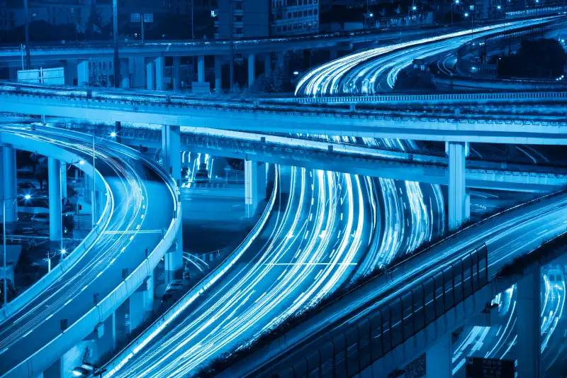 Streaks of traffic on highway interchange