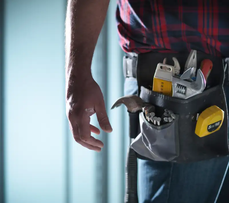 handyman in moody lighting